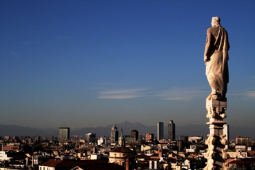 This photo of a "statue's view" of the city of Milan, Italy was taken from the top of Milan's Duomo Cathedral ... the fourth largest church in the world ... by Bart Groenhuizen of Amsterdam.